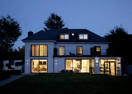 a house with lights on at night