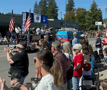 crowd watching a parade float