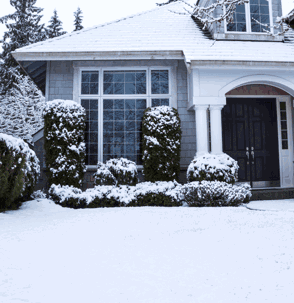 house covered in a blanket of fresh snow