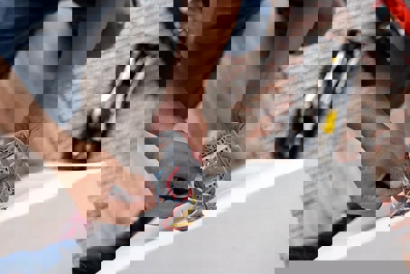 electrician connecting colorful wires